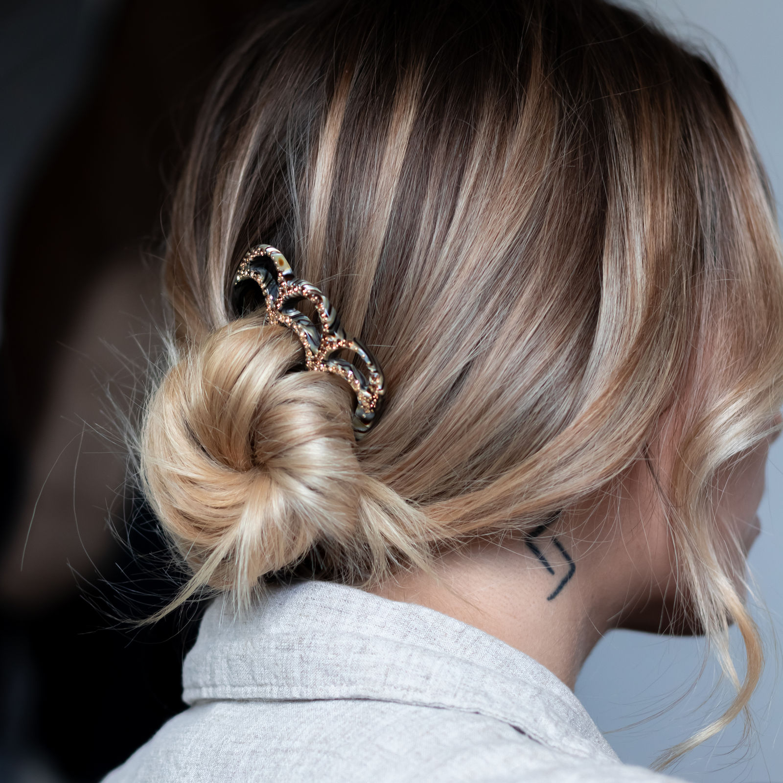 Folded ponytail with jewel clip, trendy hairstyle