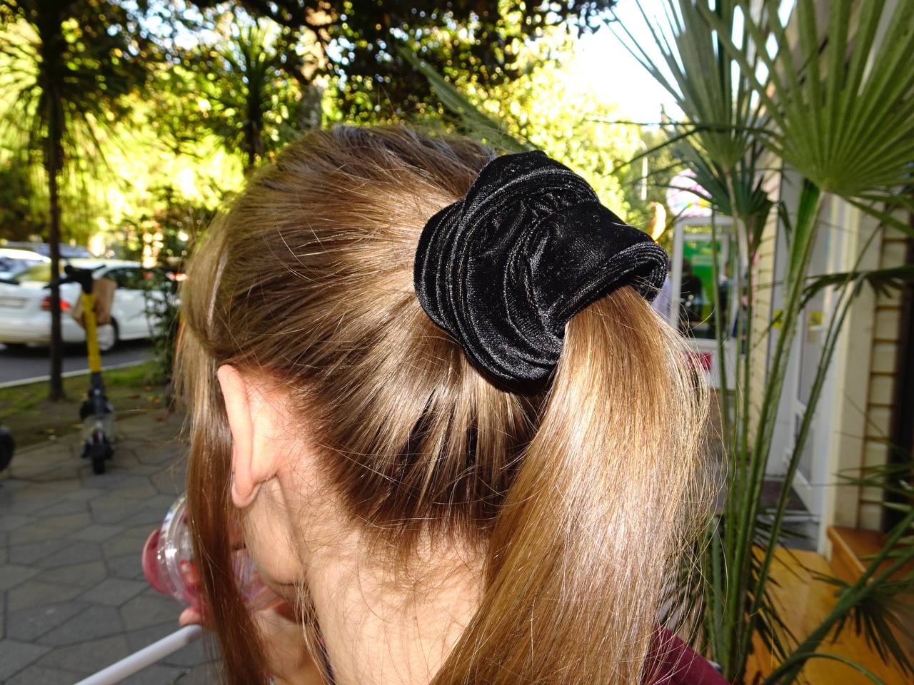 High ponytail with oversized velvet scrunchie, trendy hairstyle
